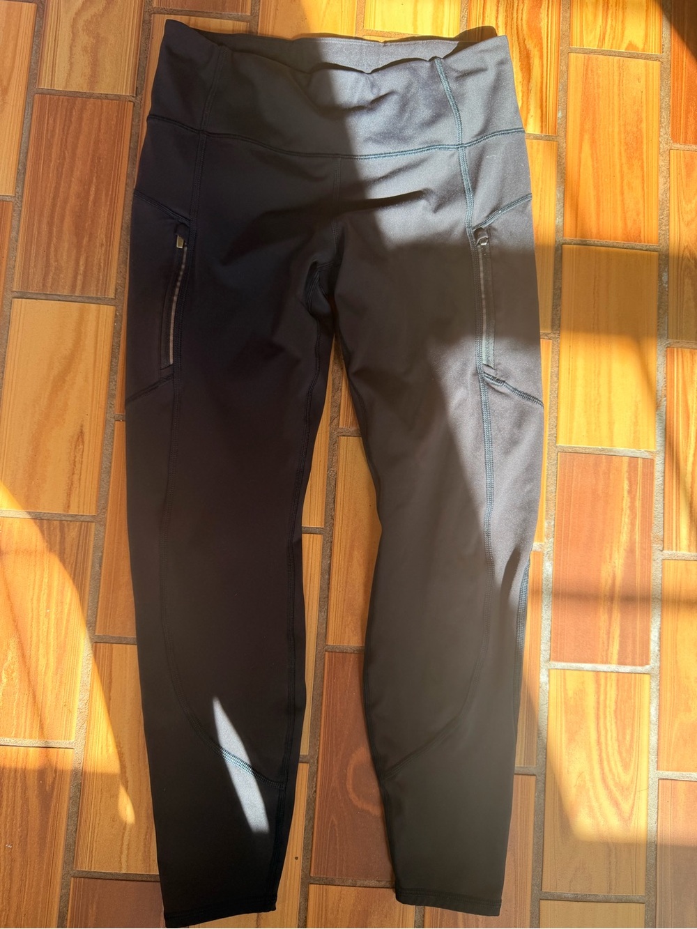 Athleta Black High-Rise Active Leggings with Zippered Side Pockets